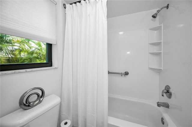 bathroom with toilet and shower / bath combo with shower curtain