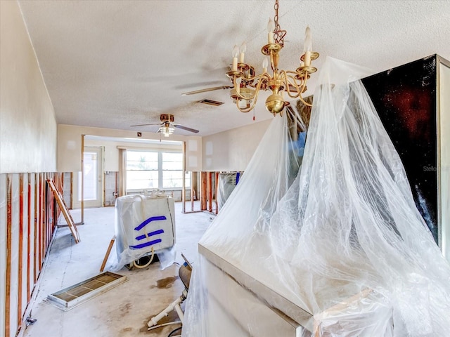 staircase featuring a textured ceiling and a notable chandelier