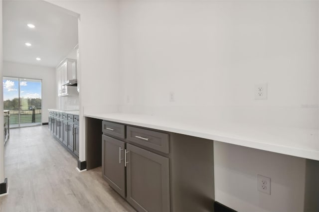 kitchen with white cabinetry and light hardwood / wood-style floors