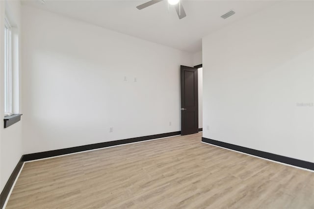 spare room featuring ceiling fan and light wood-type flooring