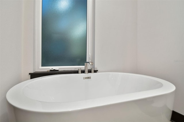 bathroom featuring a tub to relax in