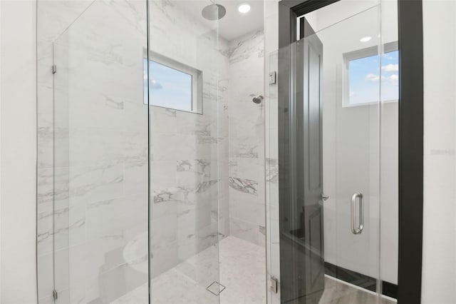 bathroom with plenty of natural light and an enclosed shower