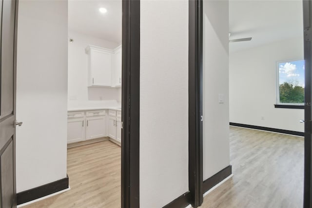 hallway featuring light hardwood / wood-style flooring