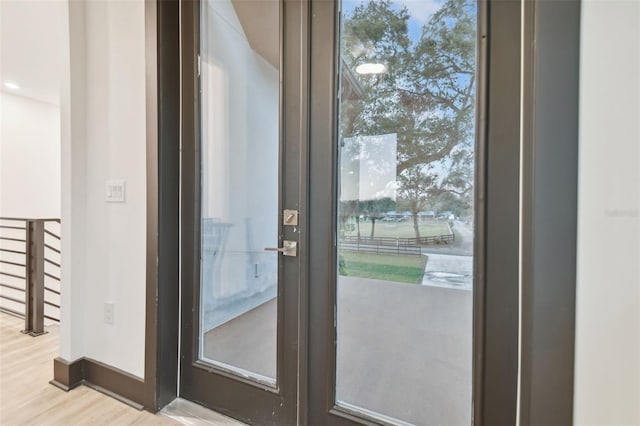 doorway to outside featuring light wood-type flooring