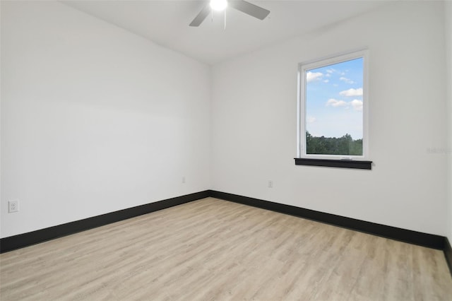 spare room with ceiling fan and light hardwood / wood-style flooring