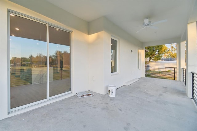 view of patio featuring ceiling fan