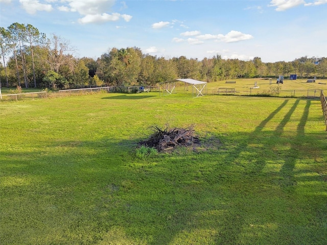 view of yard with a rural view