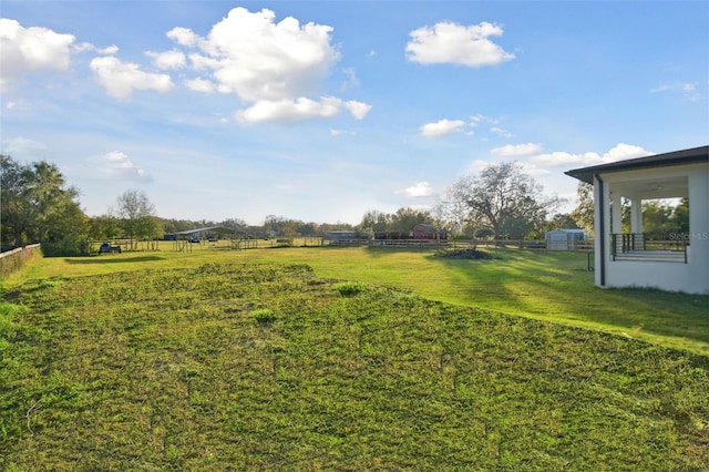 view of yard with a rural view