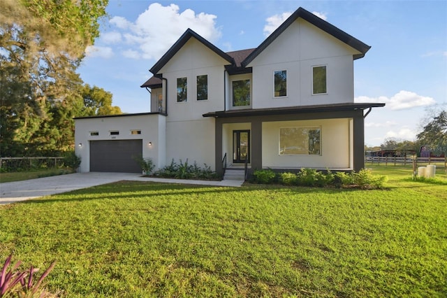 view of front of house with a garage and a front yard