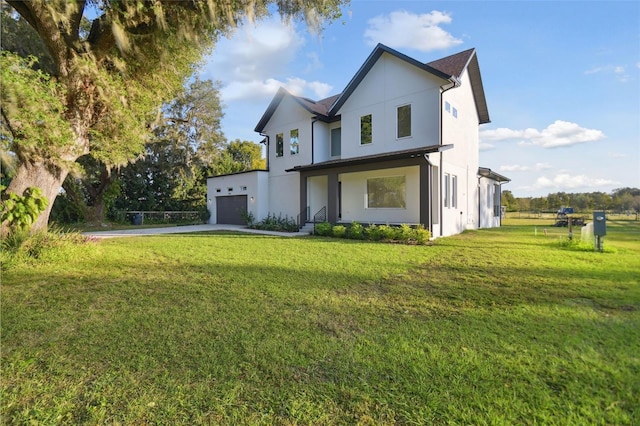 exterior space with a front yard and a garage