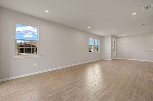 spare room with plenty of natural light