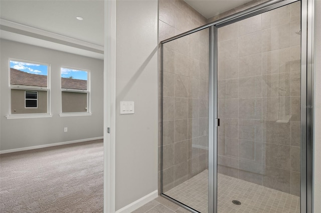 bathroom with a shower with shower door