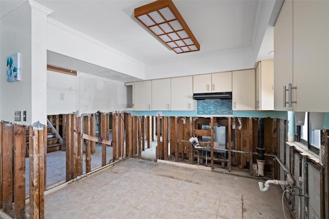 kitchen featuring cream cabinetry and ornamental molding