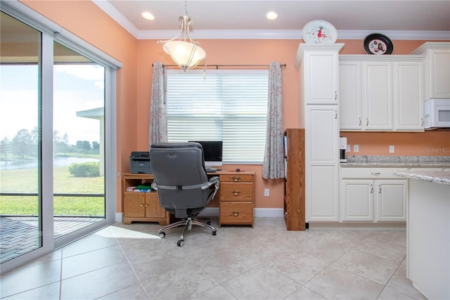 office space with plenty of natural light, ornamental molding, and light tile patterned floors