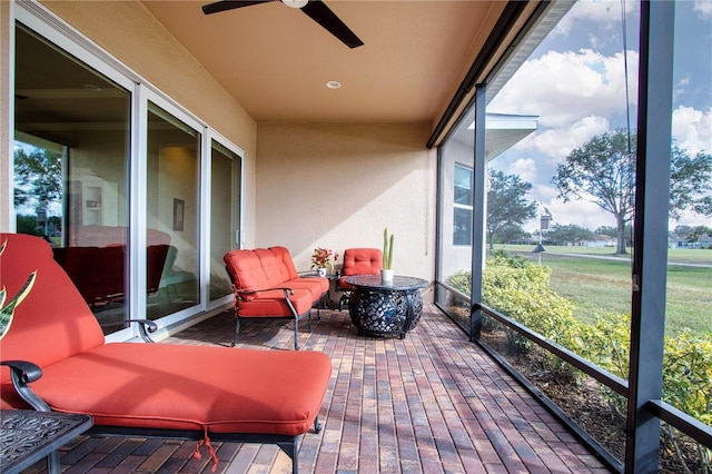 sunroom / solarium with ceiling fan