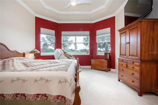 bedroom with multiple windows, ceiling fan, light carpet, and ornamental molding