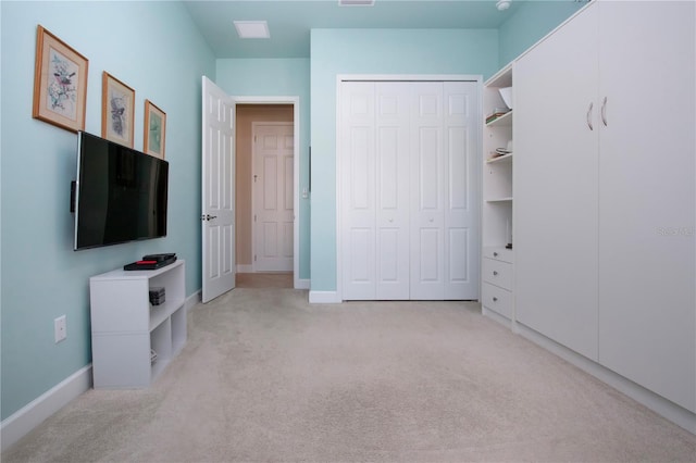 carpeted bedroom with a closet