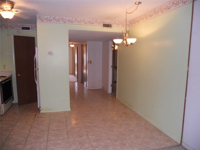 interior space with ceiling fan with notable chandelier