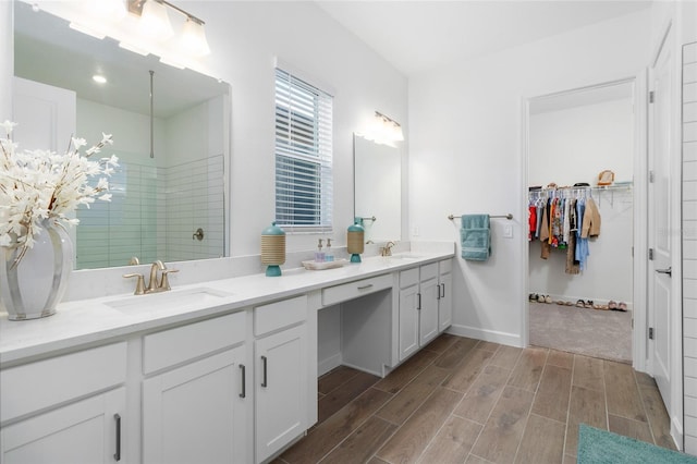 bathroom with vanity and walk in shower