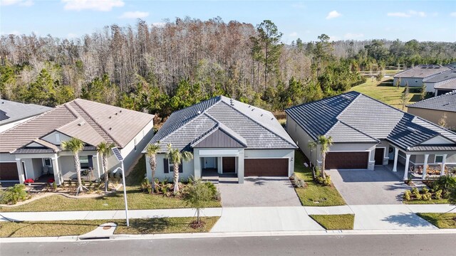 view of front of property featuring a front yard and a garage