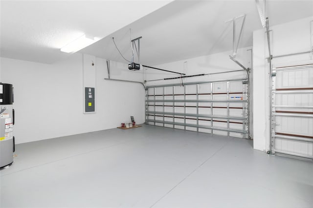 garage with water heater, electric panel, and a garage door opener