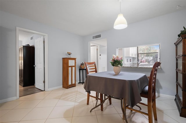 dining space with light tile patterned floors