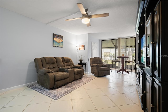 tiled living room featuring ceiling fan