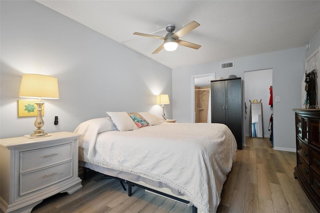 bedroom featuring dark hardwood / wood-style flooring and ceiling fan