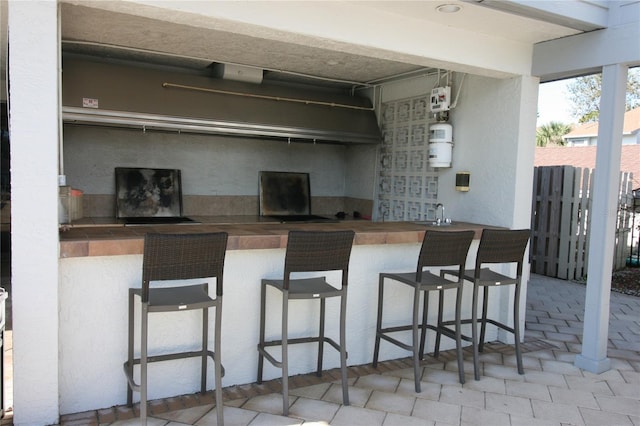 view of patio featuring exterior bar