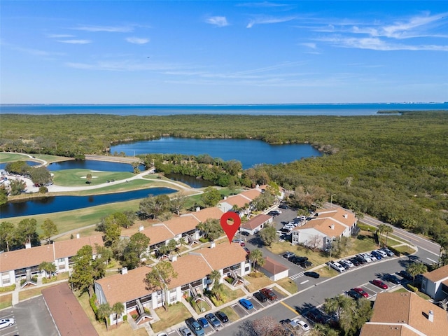 birds eye view of property featuring a water view