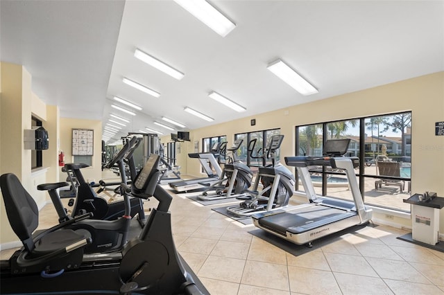 workout area featuring light tile patterned floors