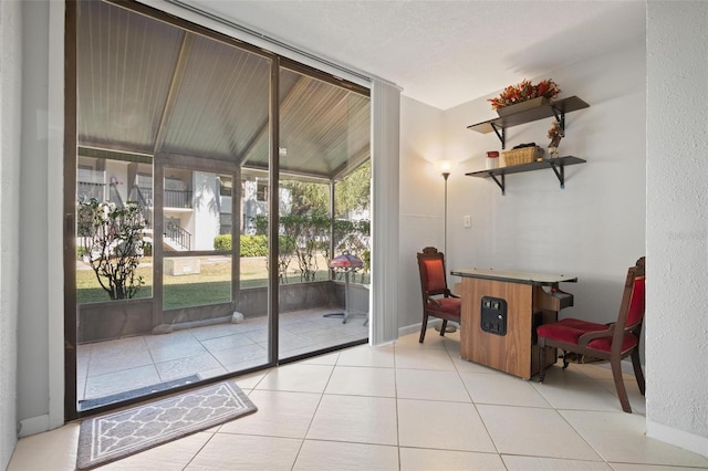 doorway to outside featuring light tile patterned floors