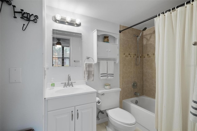 full bathroom featuring shower / bath combo, vanity, and toilet