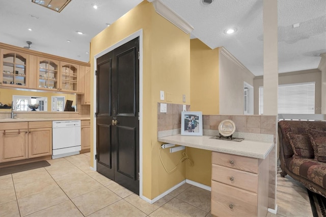 kitchen with crown molding, white dishwasher, a textured ceiling, light brown cabinetry, and light tile patterned floors