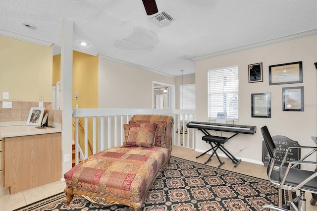 sitting room featuring ceiling fan, light tile patterned floors, a textured ceiling, and ornamental molding