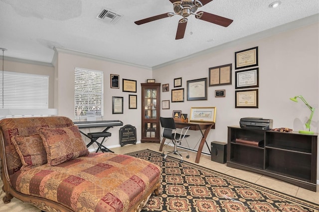 sitting room with a textured ceiling, ceiling fan, crown molding, and light tile patterned flooring