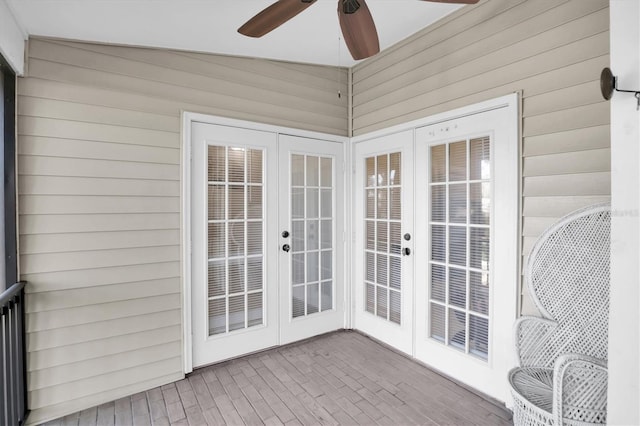 sunroom featuring ceiling fan and vaulted ceiling