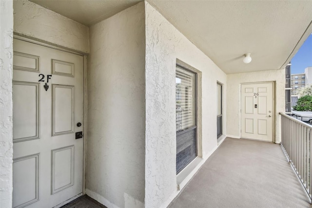 property entrance with a balcony