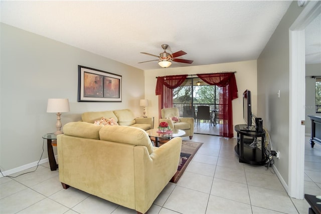 tiled living room featuring a textured ceiling and ceiling fan