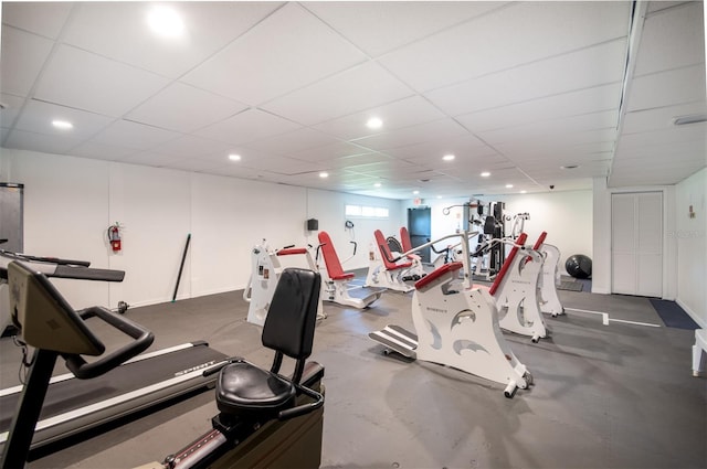 exercise room with a drop ceiling