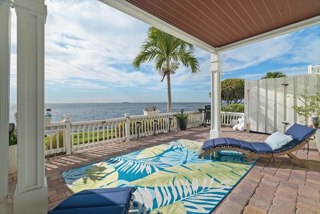 view of patio featuring a water view