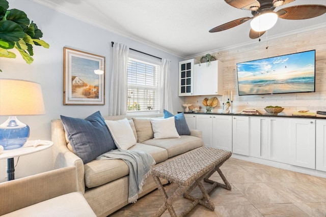 living room featuring wood walls and crown molding