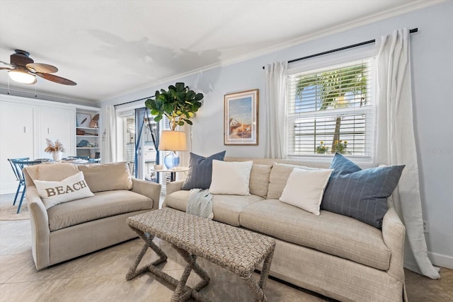 living room featuring light tile patterned floors, ceiling fan, and crown molding