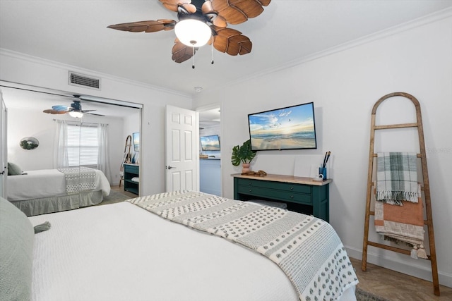 bedroom with ceiling fan and ornamental molding