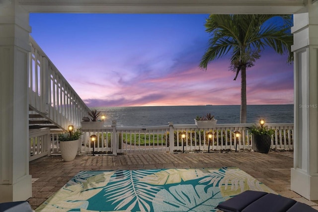 pool at dusk with a water view