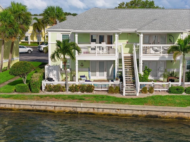 rear view of house with a water view