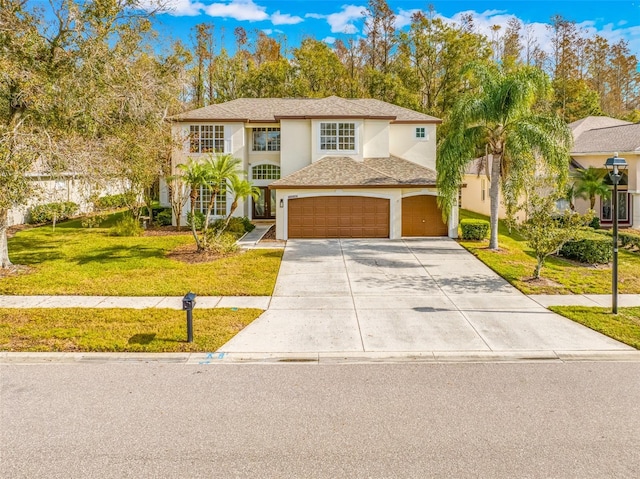 view of front of house featuring a front yard and a garage