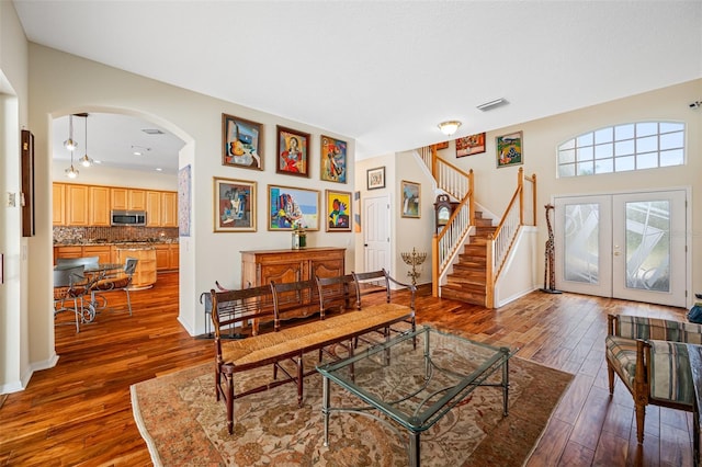 living room with french doors and dark hardwood / wood-style floors