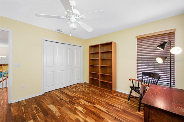 office space with dark hardwood / wood-style floors and ceiling fan