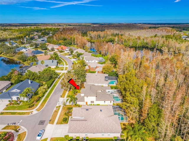 birds eye view of property with a water view